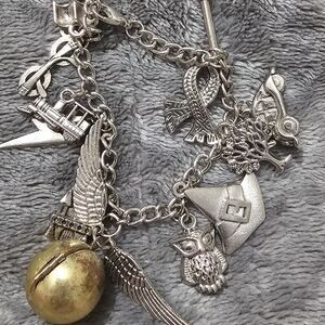 Silver Charm Bracelet with Gold Bell